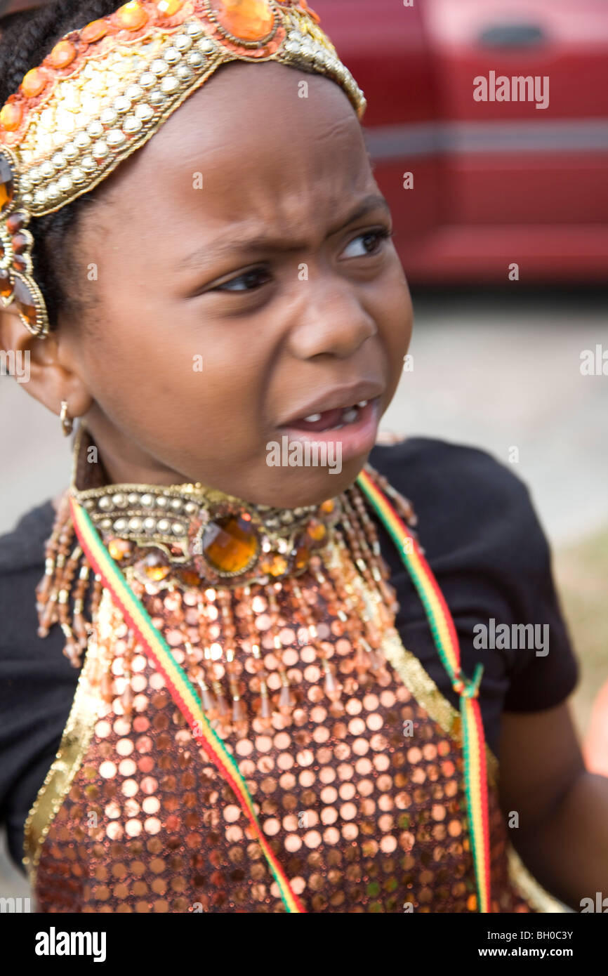 Child in carnival costume. Portrait of little girl crying. Notting Hill Carnival, Notting Hill. London. England. UK. Stock Photo
