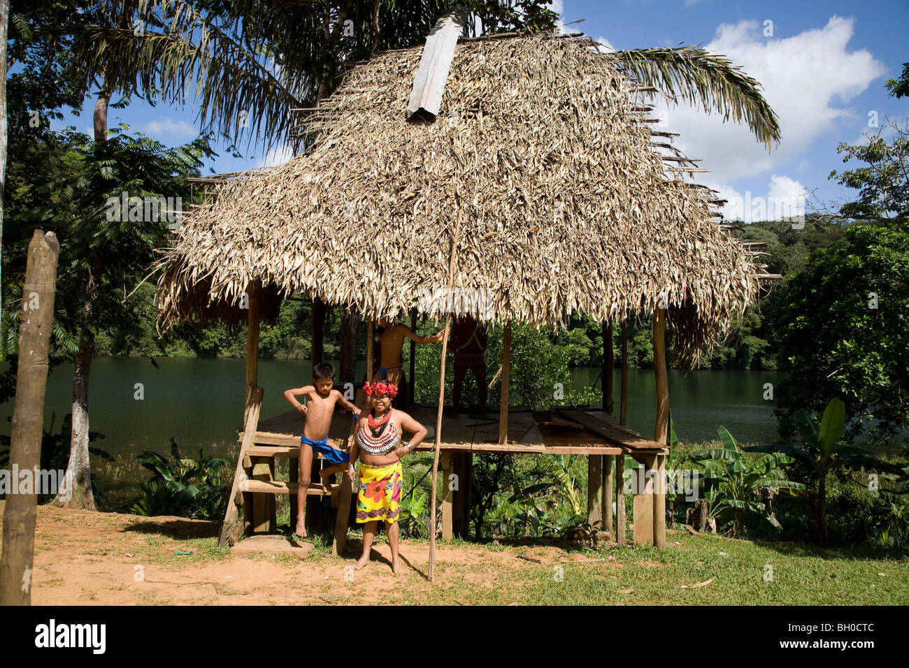 Mature woman with children (two boys). Embera Indian Village. Chagres ...