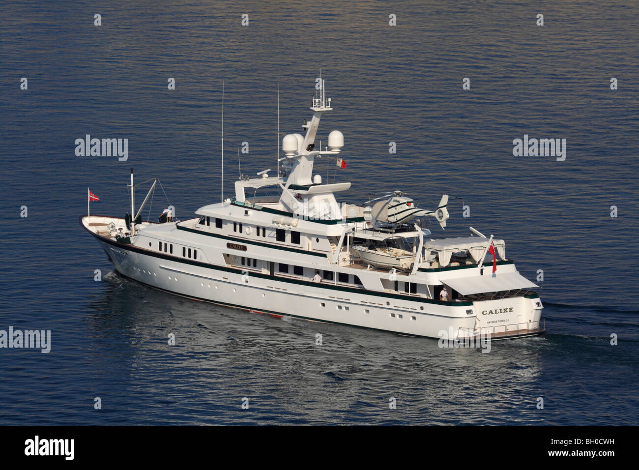 The luxury super yacht Calixe cruising with a helicopter on board Stock Photo