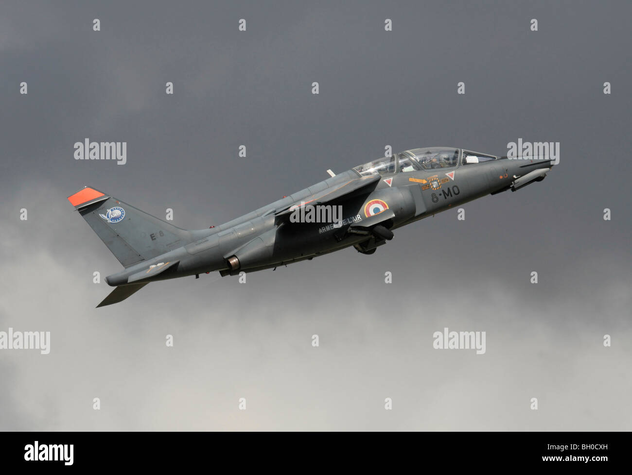 Military pilot training. French Air Force Alpha Jet two-seat trainer plane flying on takeoff. Side view. Stock Photo