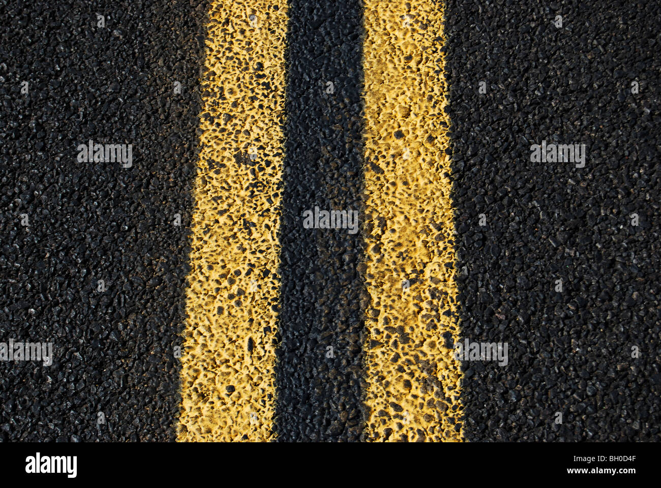 double yellow lines on blacktop pavement Stock Photo Alamy