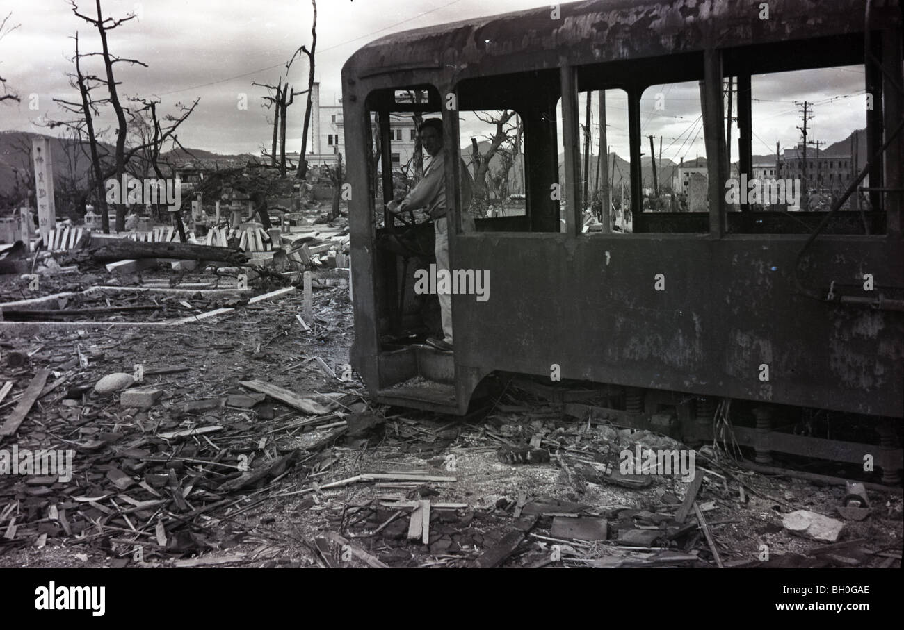 GI standing in a burned up trolley. Scene from Hiroshima, Japan in ruins shortly after the Atomic Bomb was dropped Stock Photo