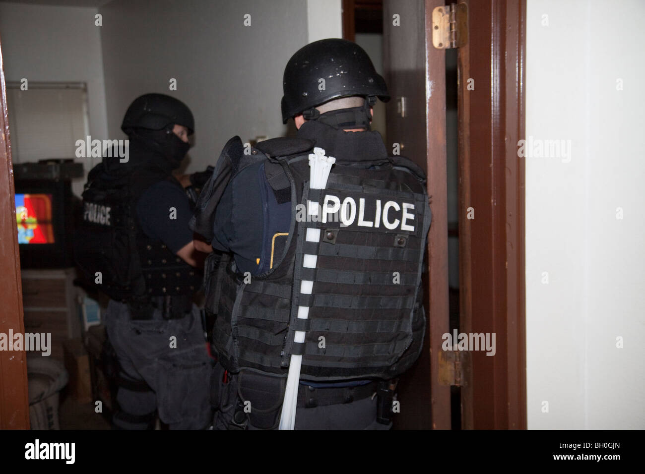 Tactical squad from Street Narcotics Unit in Kansas City, MO, entering