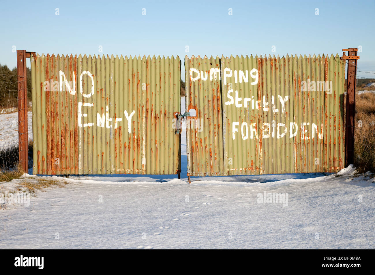 Corrugated metal fence with No Entry Sign Stock Photo