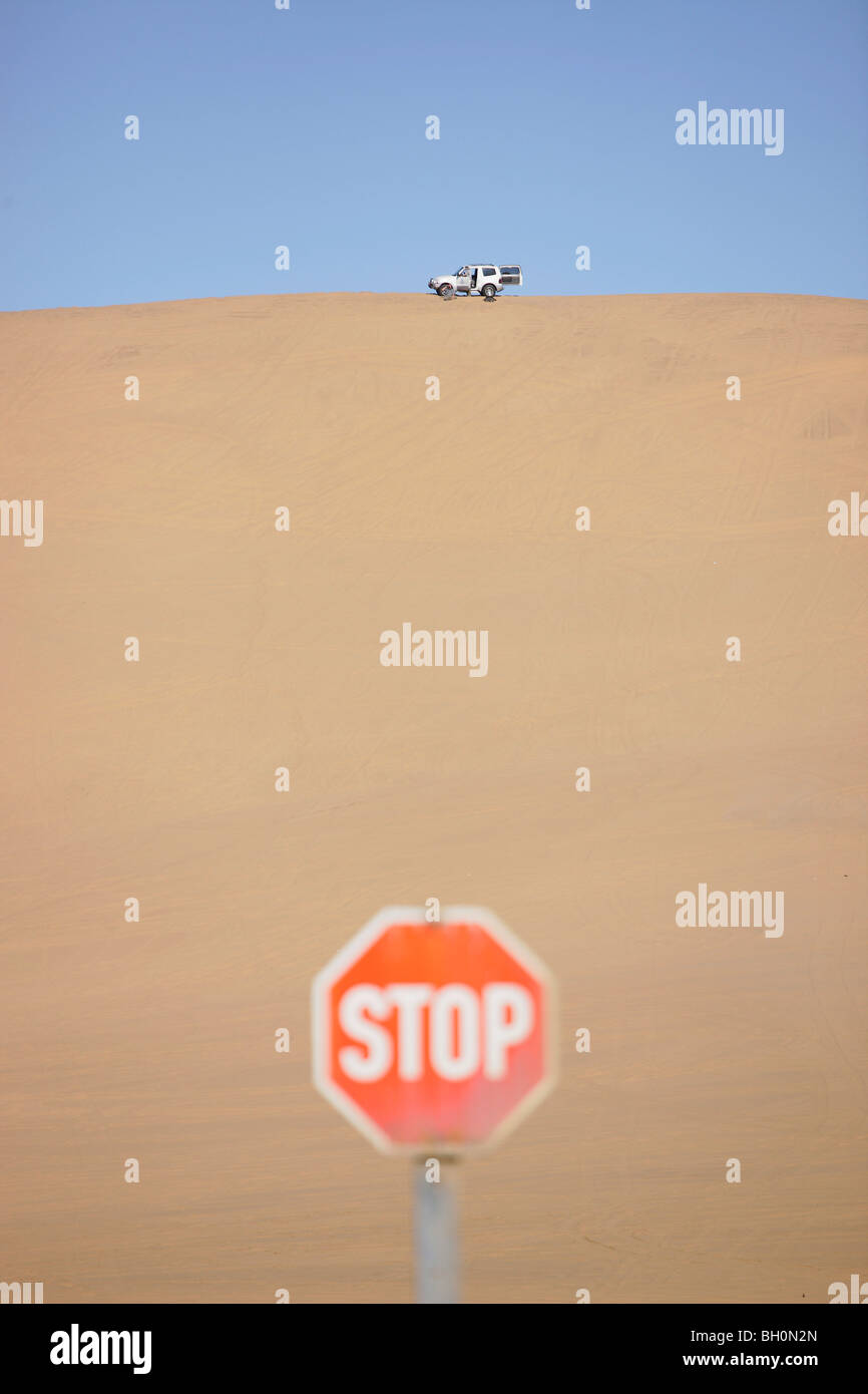 Car driving on sand dunes near Swakopmund, Namibia, Africa Stock Photo