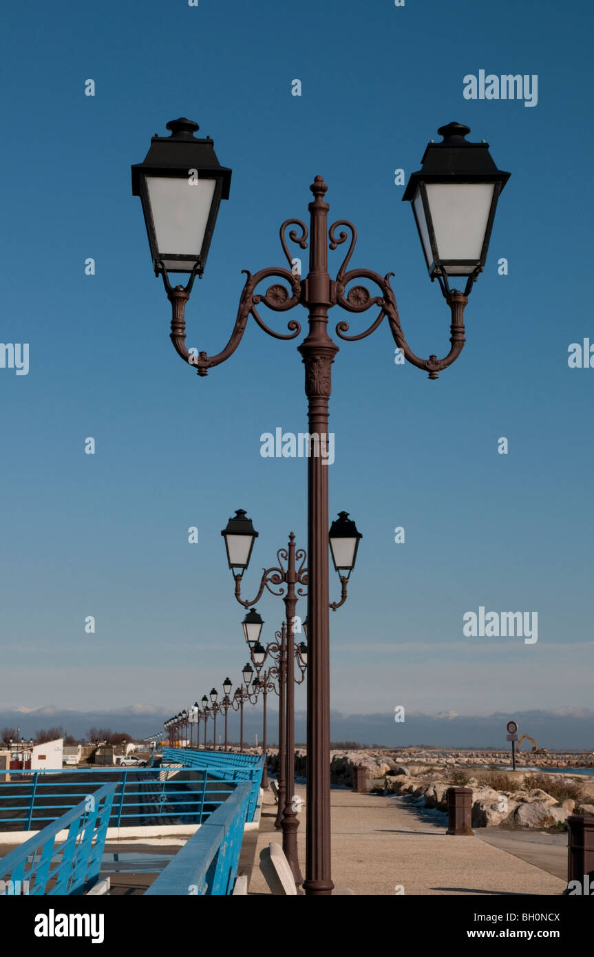 Lampposts along the beach front, Saintes-Maries-de-la-Mer, Southern France Stock Photo