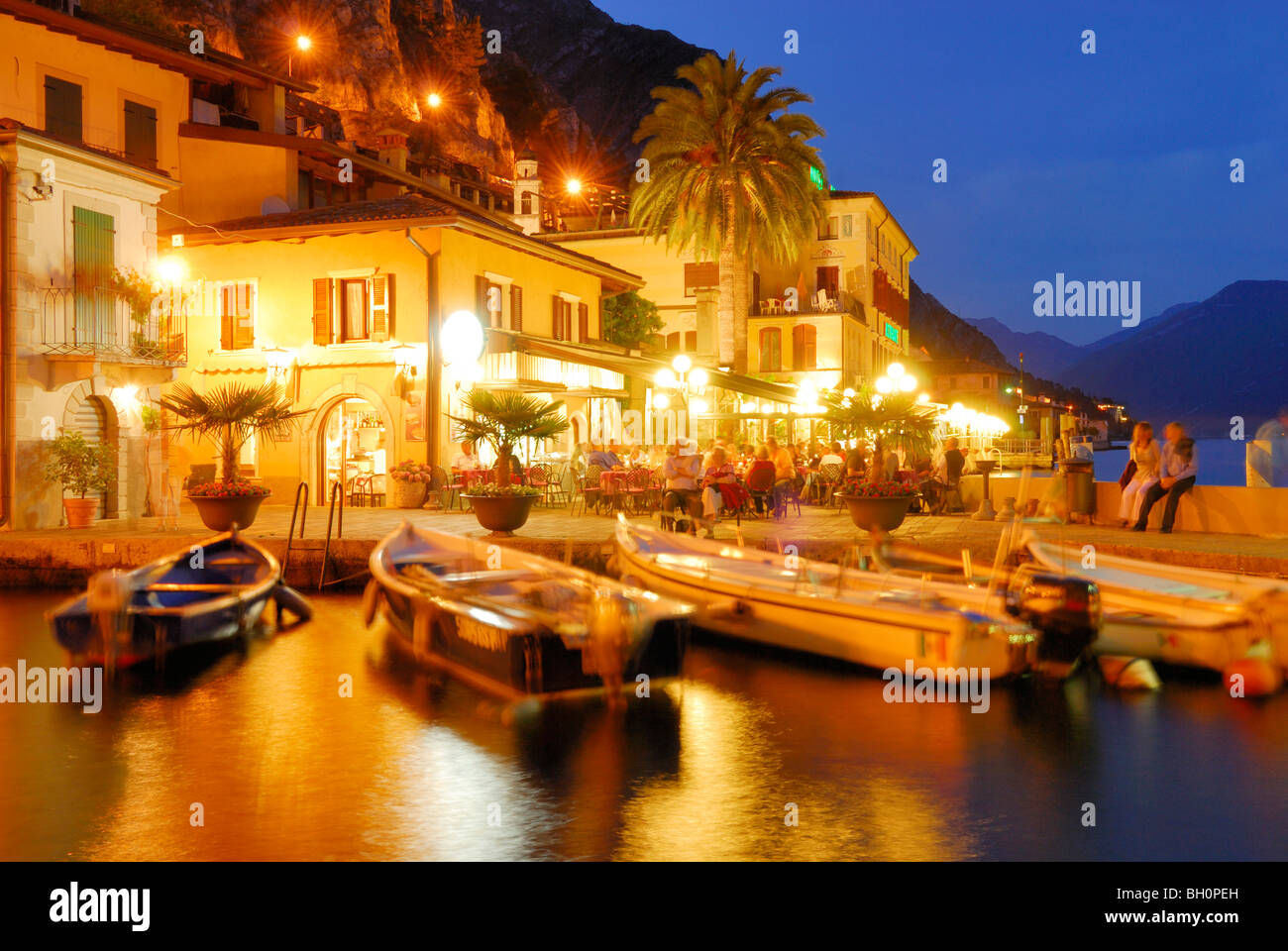 Boats in marina in the evening, Limone sul Garda, Lombardy, Italy Stock Photo
