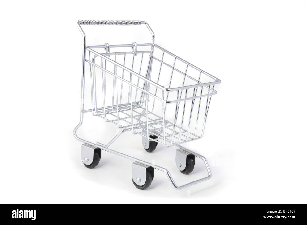 An empty metal shopping cart on wheels isolated on white background. Stock Photo