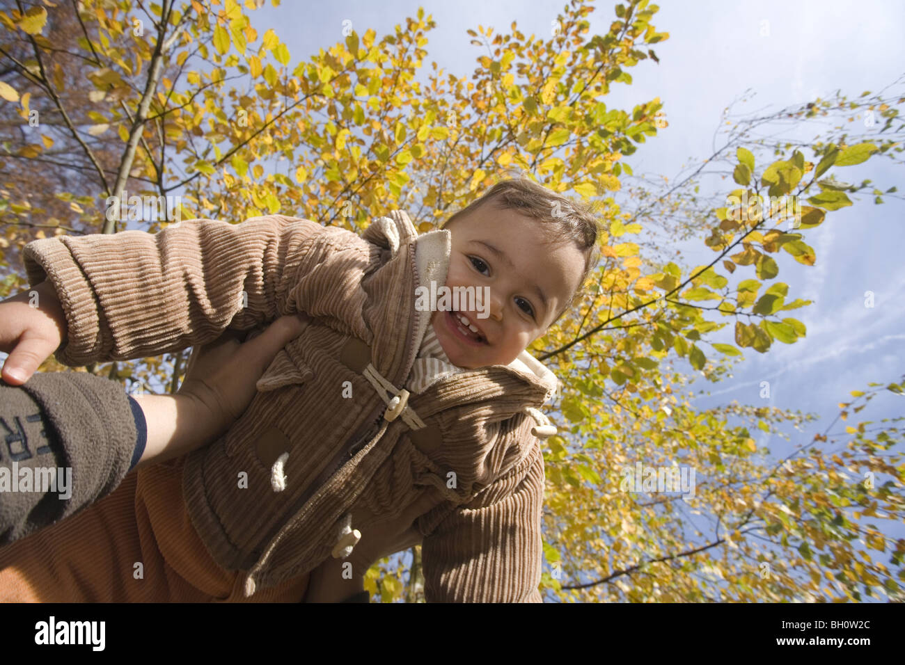 Child lifted up, Muenchen, Bavaria, Germany Stock Photo