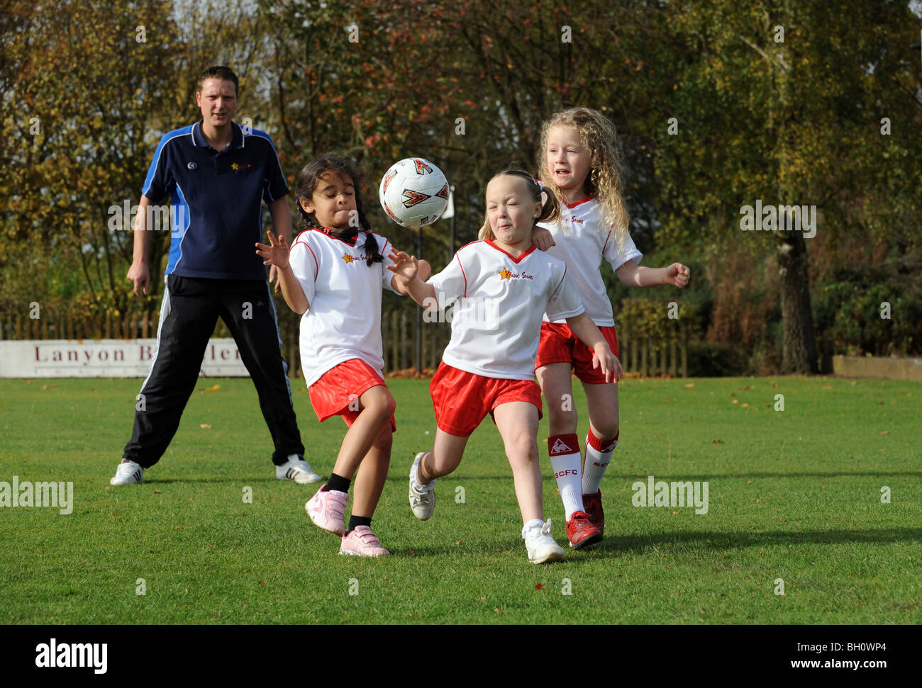 Girls football coaching Stock Photo