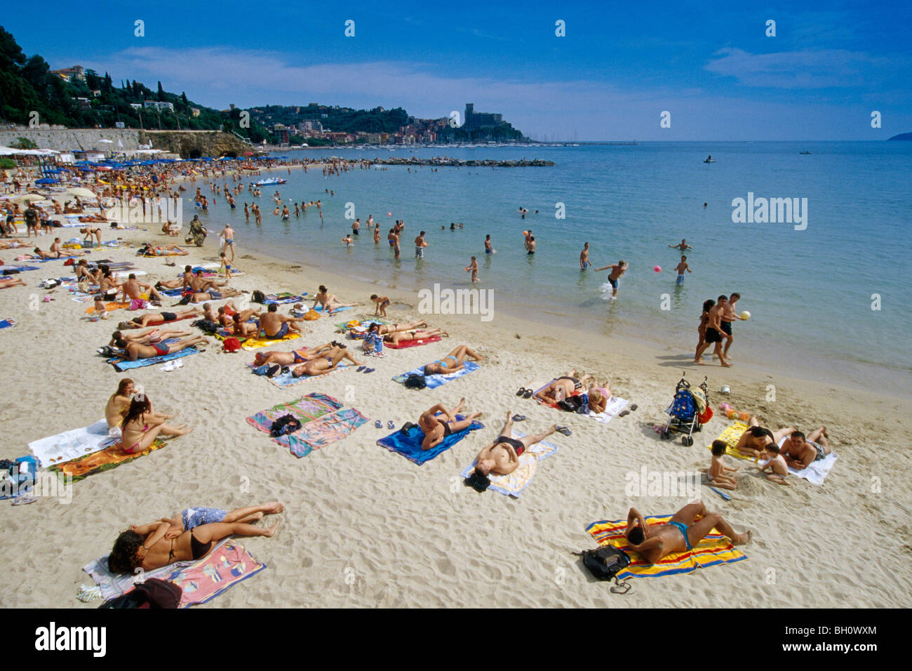 People sunbathing on the beach under blue sky, Golfo della Spezia