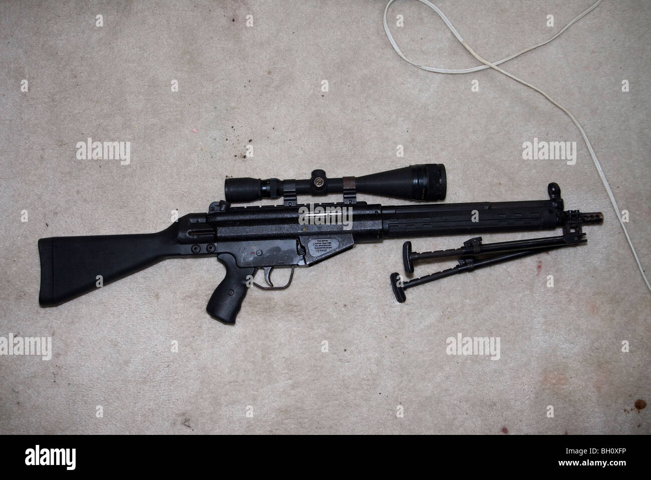Automatic rifles. Located inside residence in the possession of felons. drug related search warrant KCPD, MO. Stock Photo