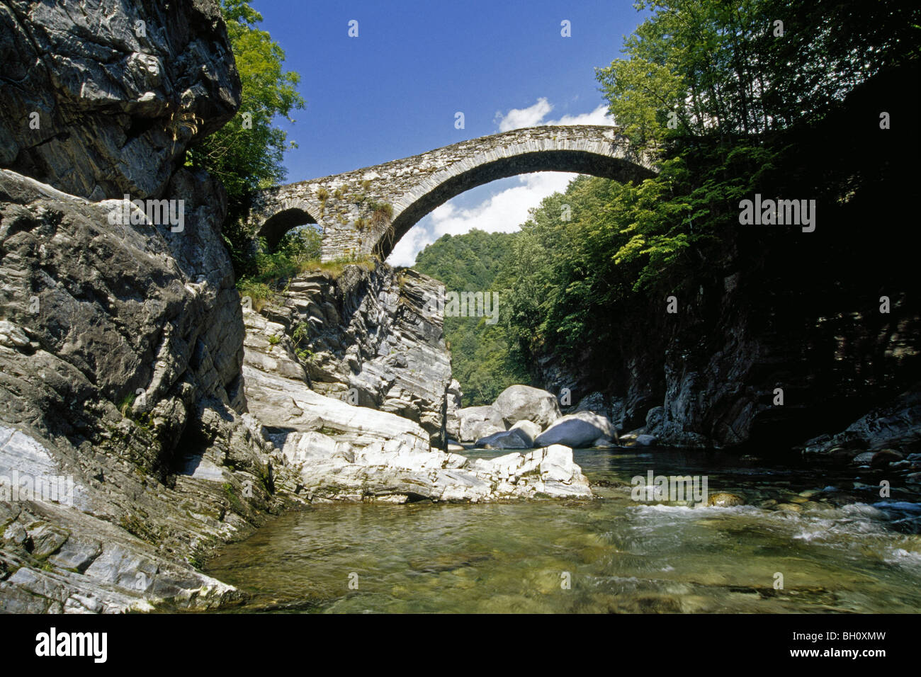 Stone bridge at Valle Lavizzara in the sunlight, Ticino, Switzerland, Europe Stock Photo