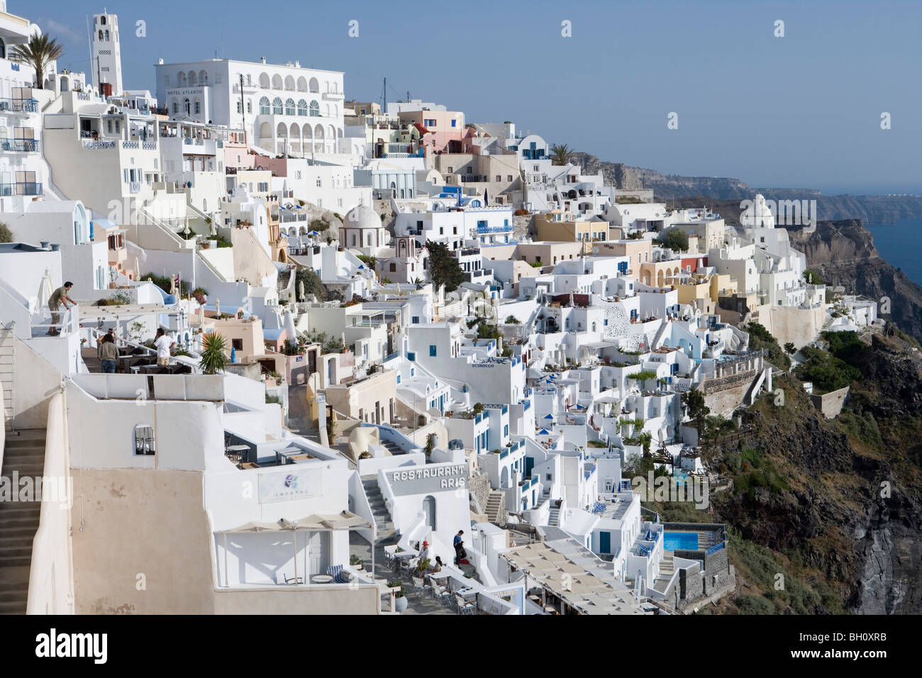 Houses at a mountainside in the sunlight, Fira, Santorini, Greece, Europe Stock Photo