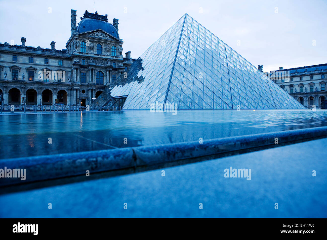 The Louvre museum with the Louvre Pyramid, Paris, France Stock Photo