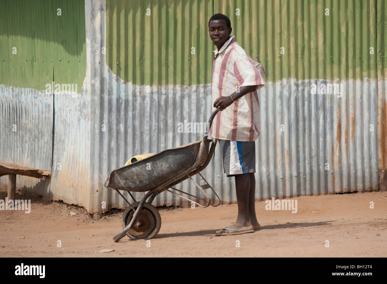 Man with wheelbarrow, Kenya, Africa Stock Photo Alamy