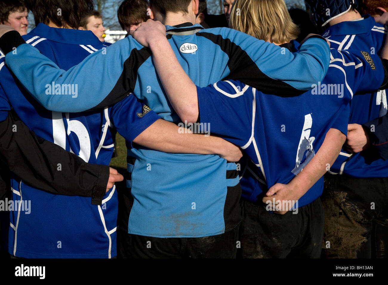 Teenage boys rugby team huddle Stock Photo