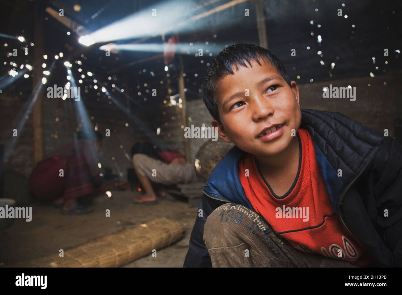 Smiling boy in a cook shack, Pokhara, Nepal Stock Photo