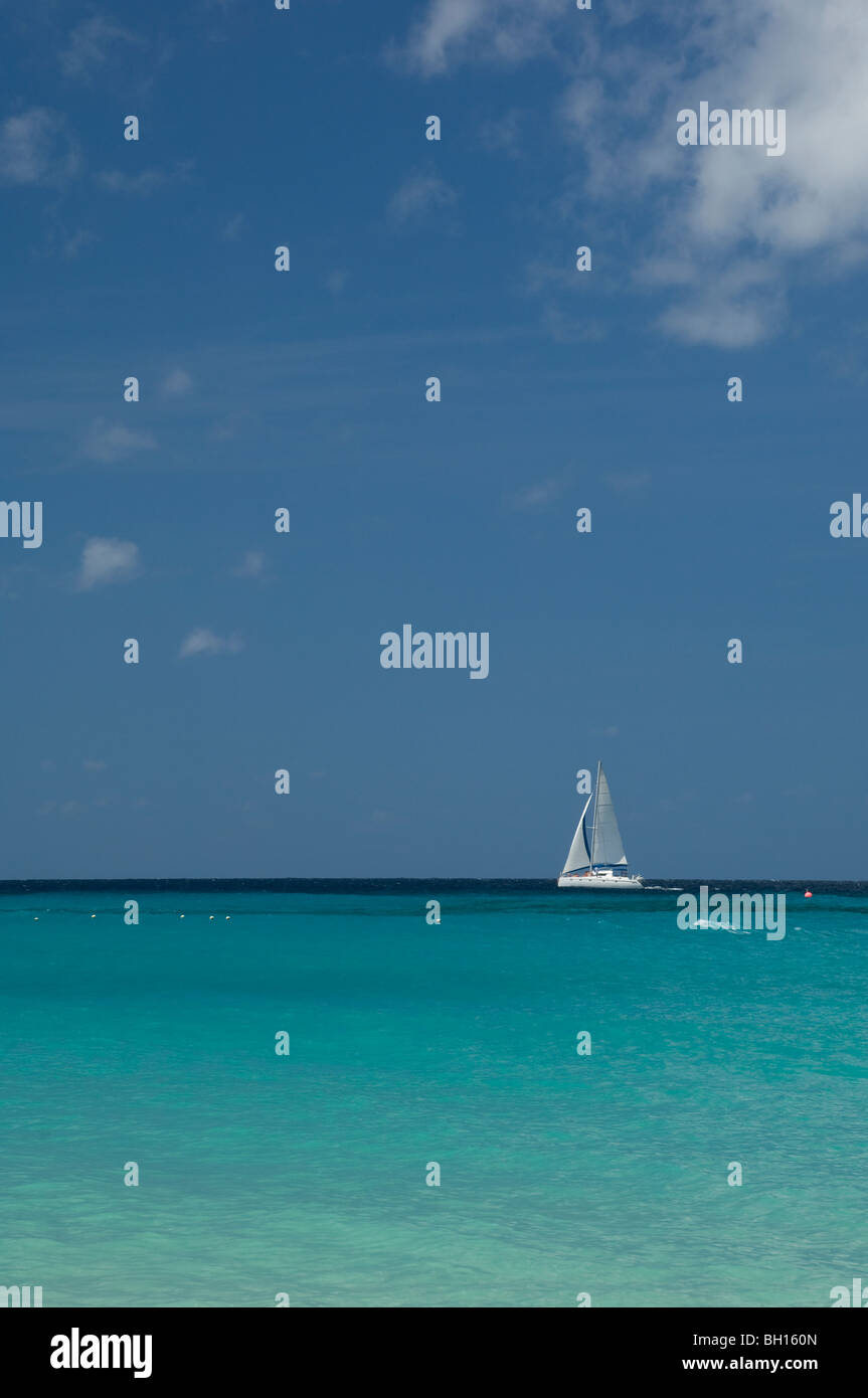 A sailboat off the west coast of Barbados, The Windward Islands, The Caribbean Stock Photo