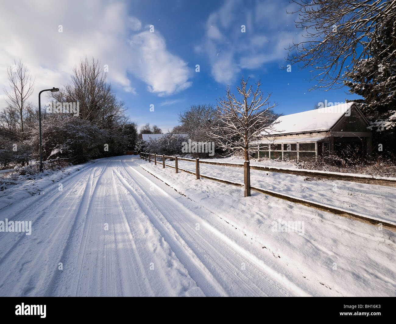 A snow covered rural landscape in a village Stock Photo - Alamy