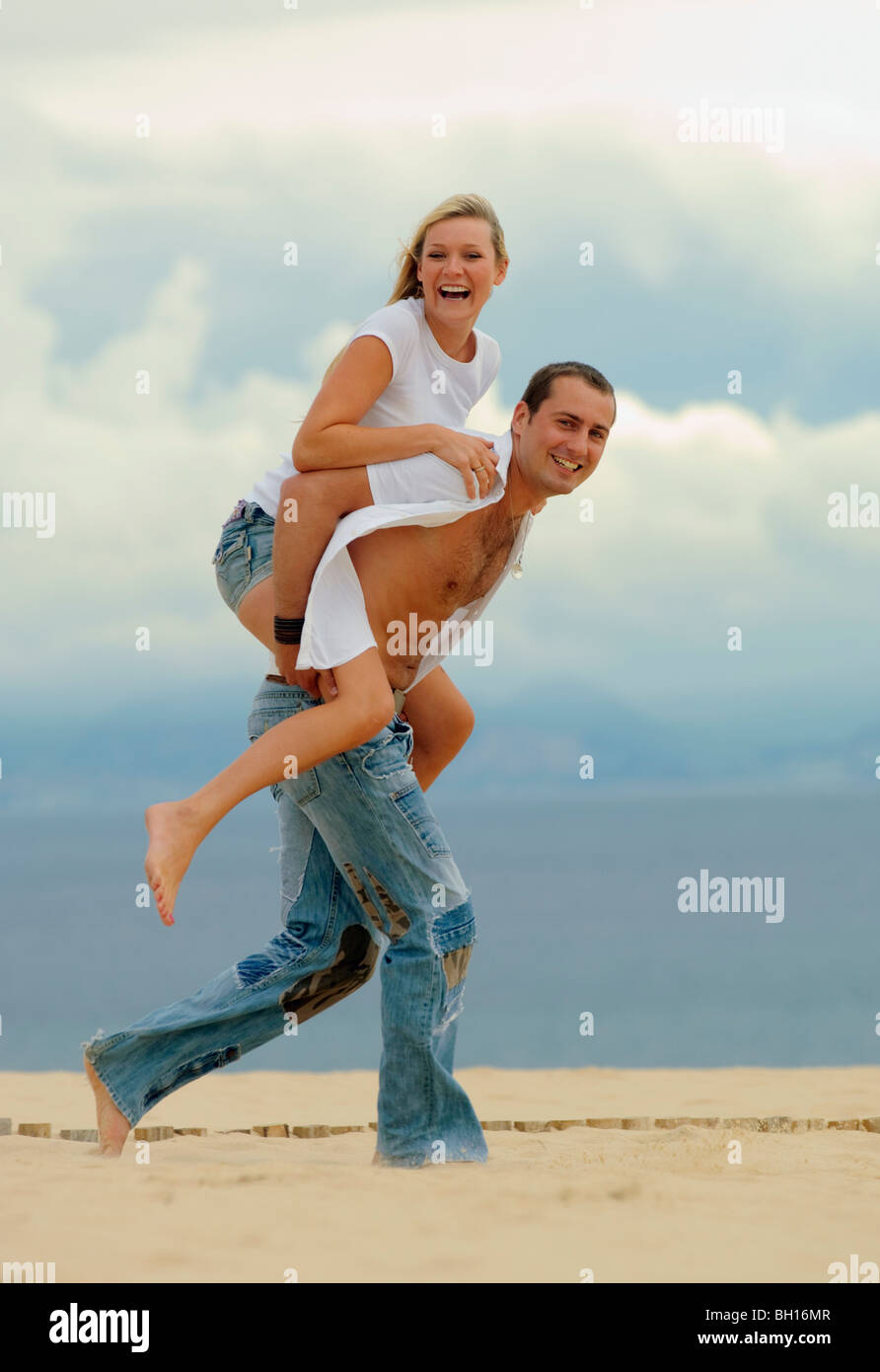 Two young couples having fun on the beach hi-res stock photography and ...