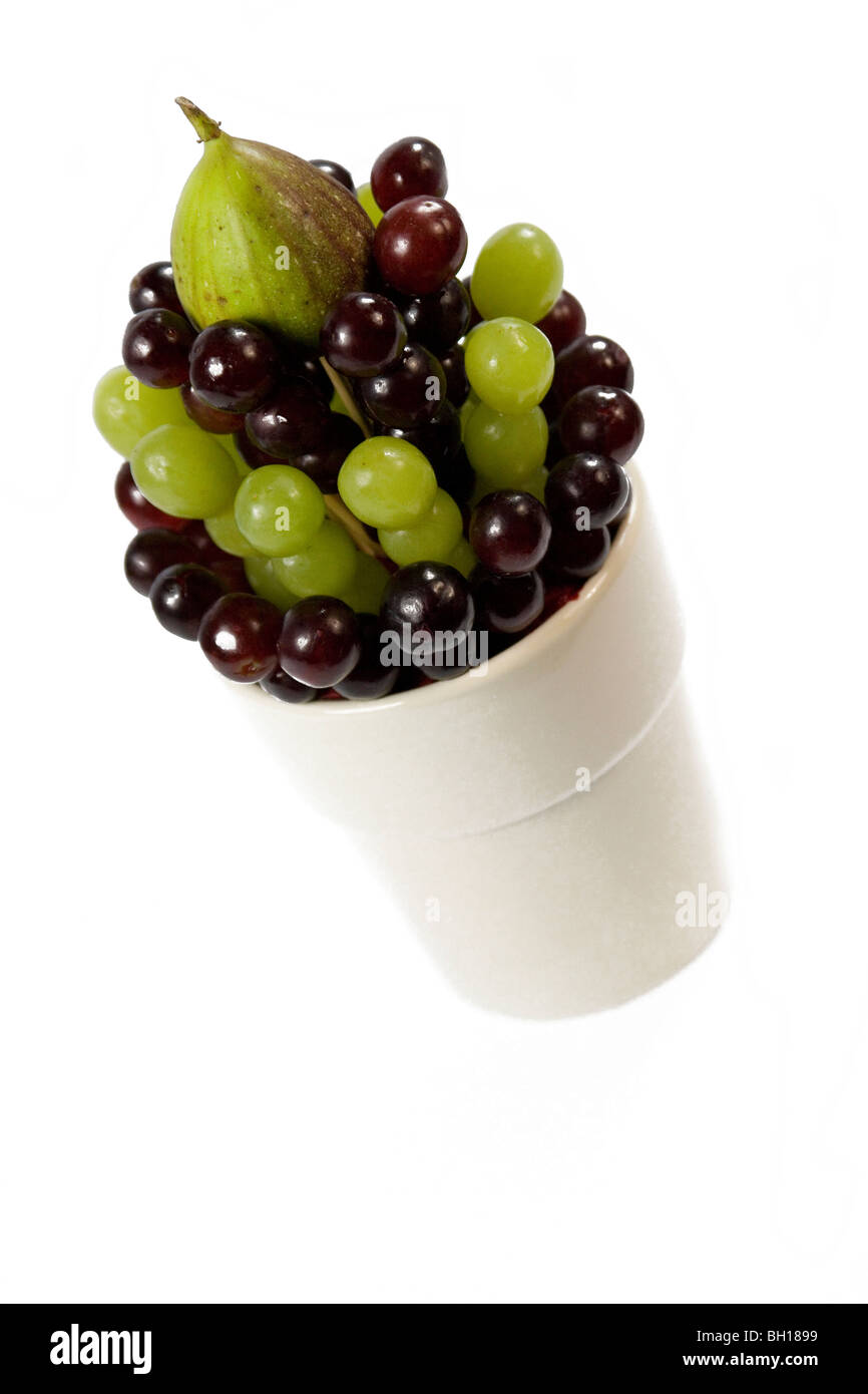 a fresh fruit table arrangement of fruit in a vase for a table