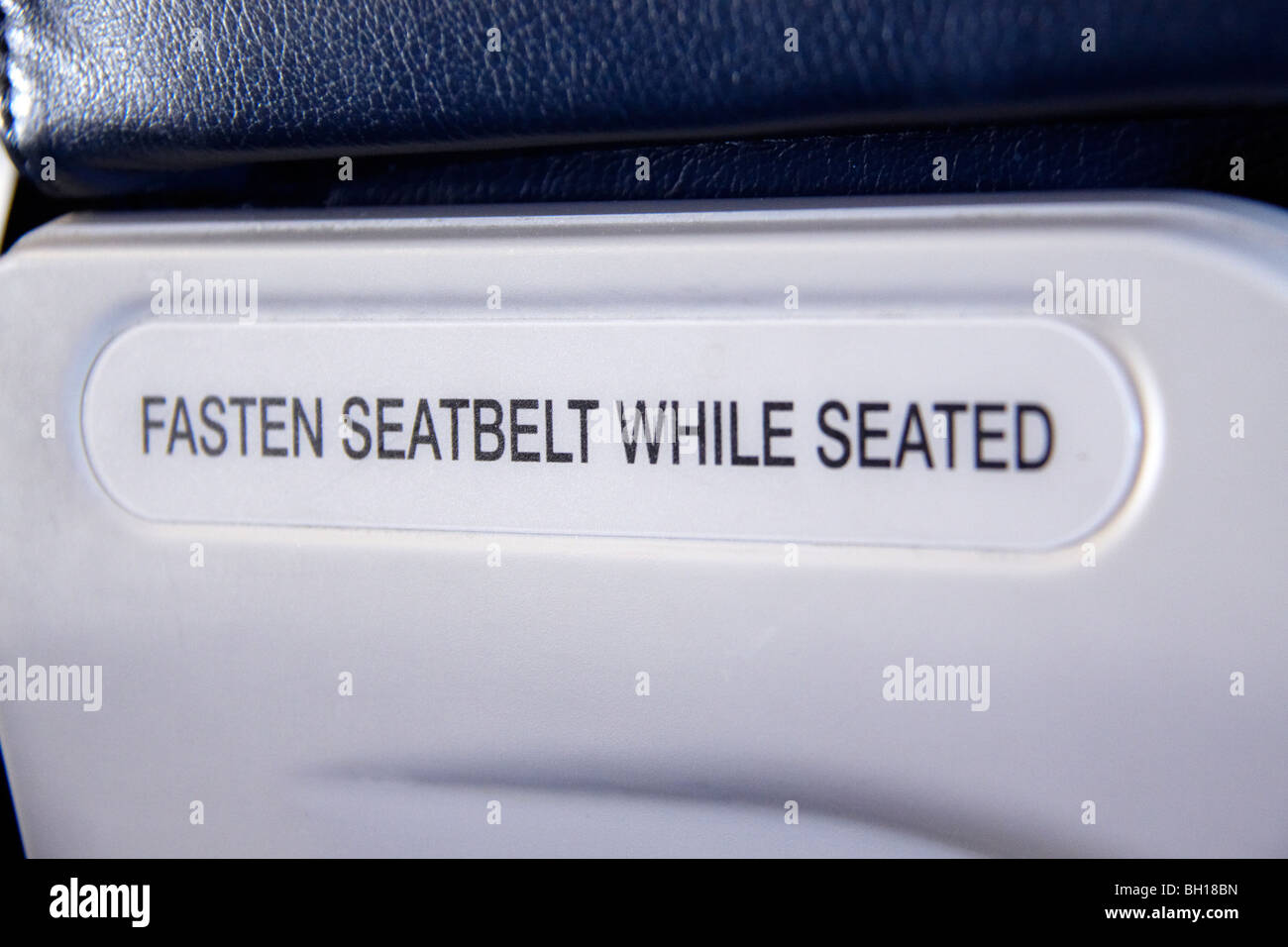 Fasten Seatbelt sign on a airplane seat Stock Photo - Alamy