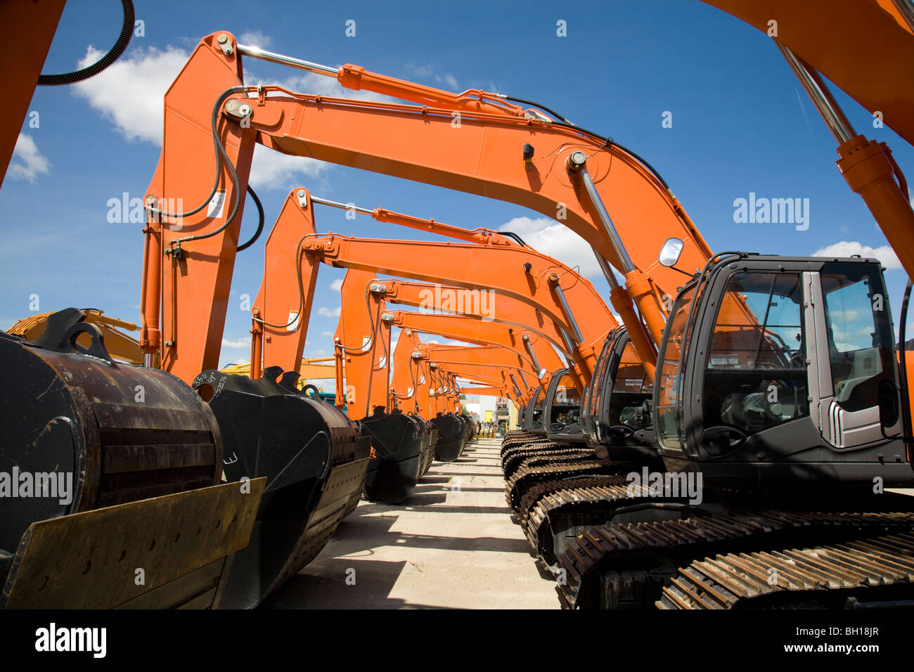 Several backhoes on a lot Stock Photo Alamy