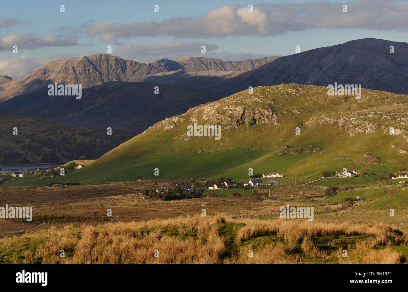 The scattered remote township of Elphin and the distant Ben More Assynt range, west Sutherland, Scottish Highlands, UK. Stock Photo