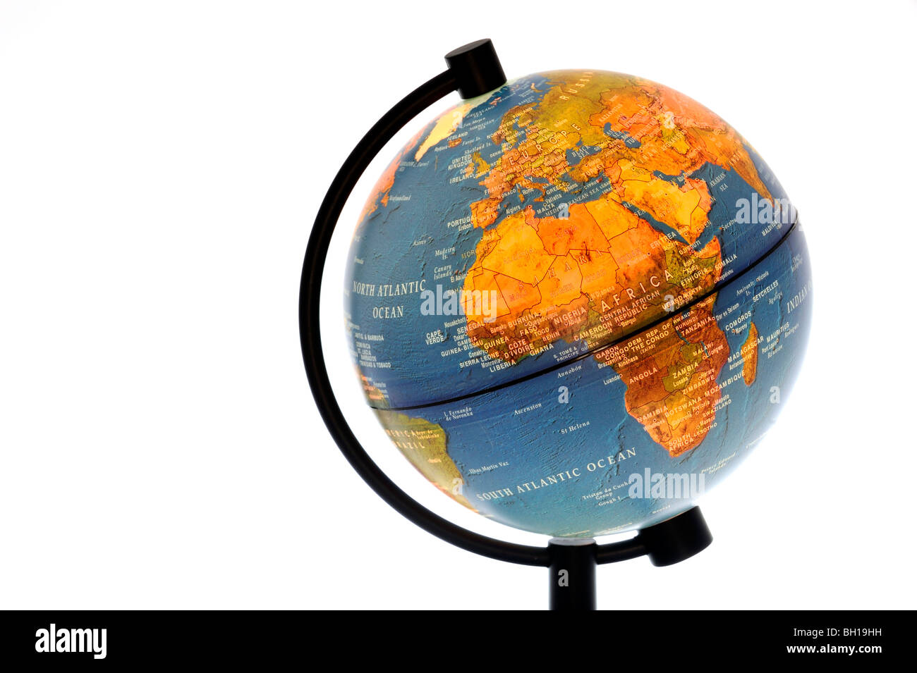 Illuminated terrestrial globe against white background Stock Photo - Alamy