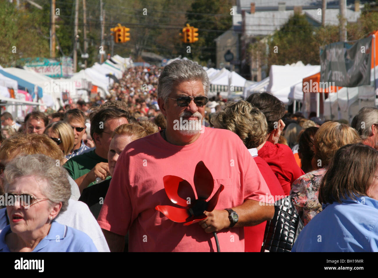 Man With Craft Flower and Crowd at Sauerkraut Festival, Waynesville