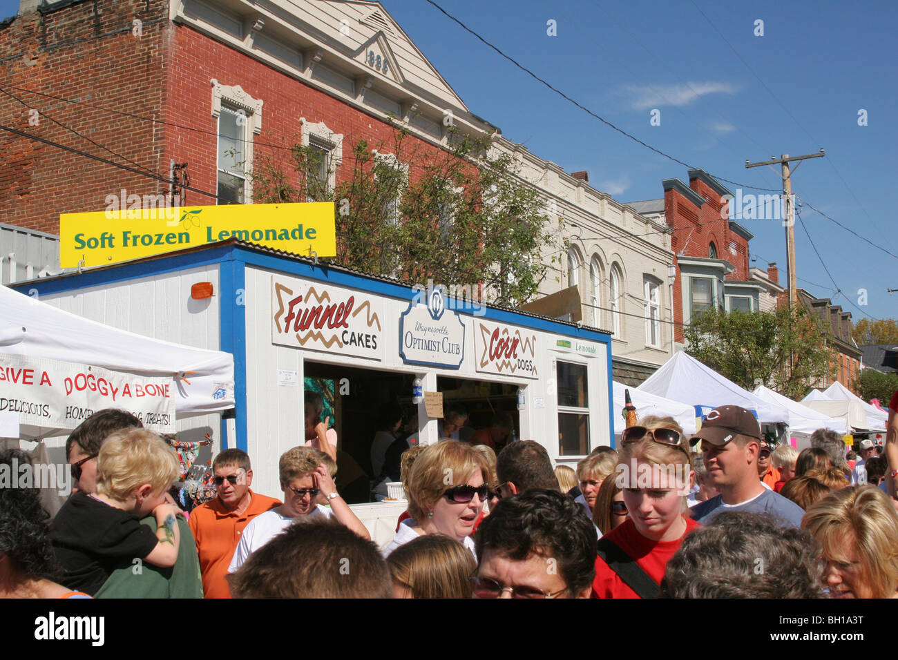 Waynesville Optimist club food booth and crowd at Sauerkraut Festival