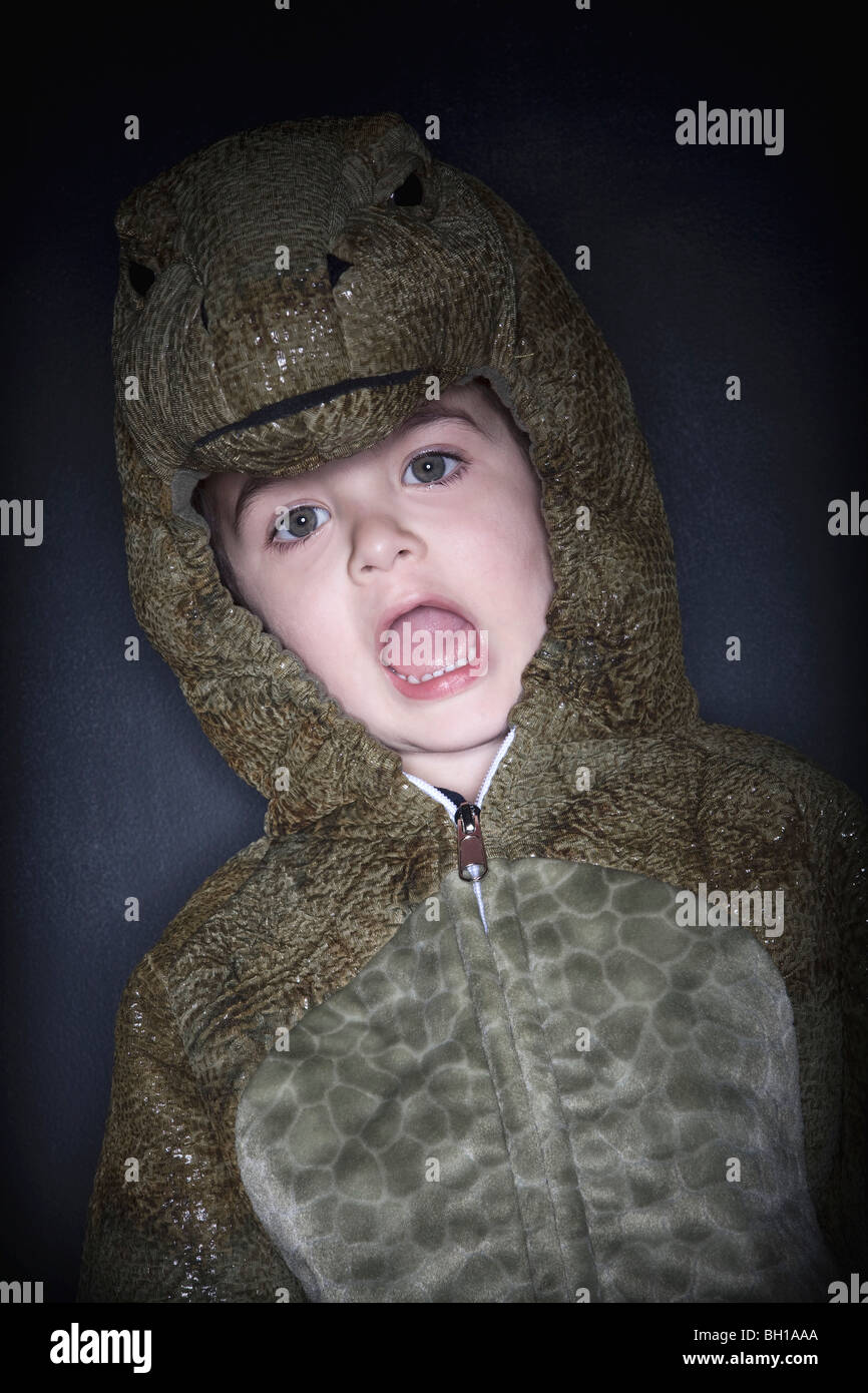 Toddler in a reptile costume Stock Photo