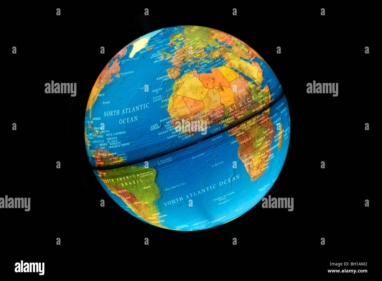 Illuminated terrestrial globe against black background Stock Photo