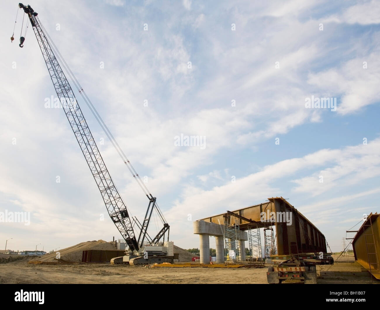 Crane and heavy road construction equipment for bridge building Stock