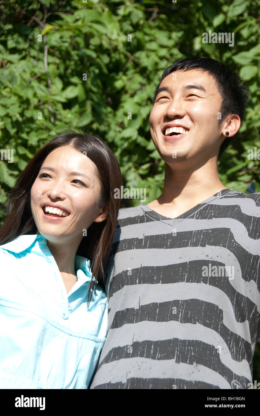 Young couple of Asian ethnicity in Assiniboine Park, Winnipeg, Manitoba, Canada Stock Photo