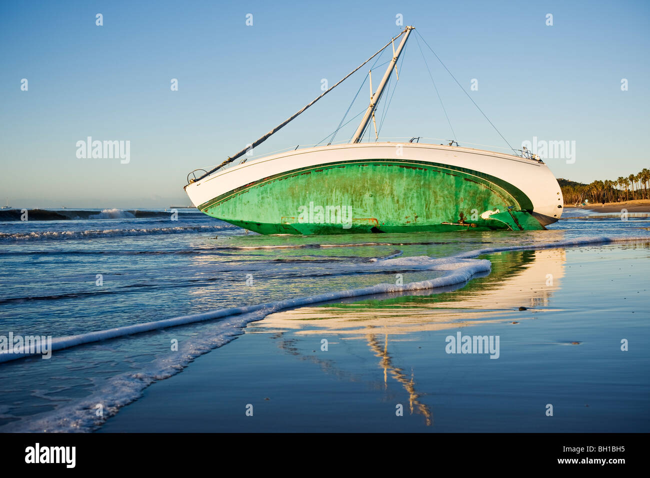 Santa Barbara, California: Sailboat washed ashore on beach during ...