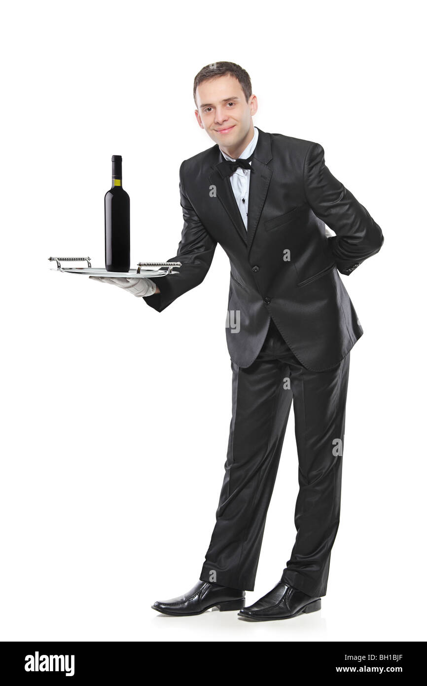 A butler carrying a red wine bottle Stock Photo