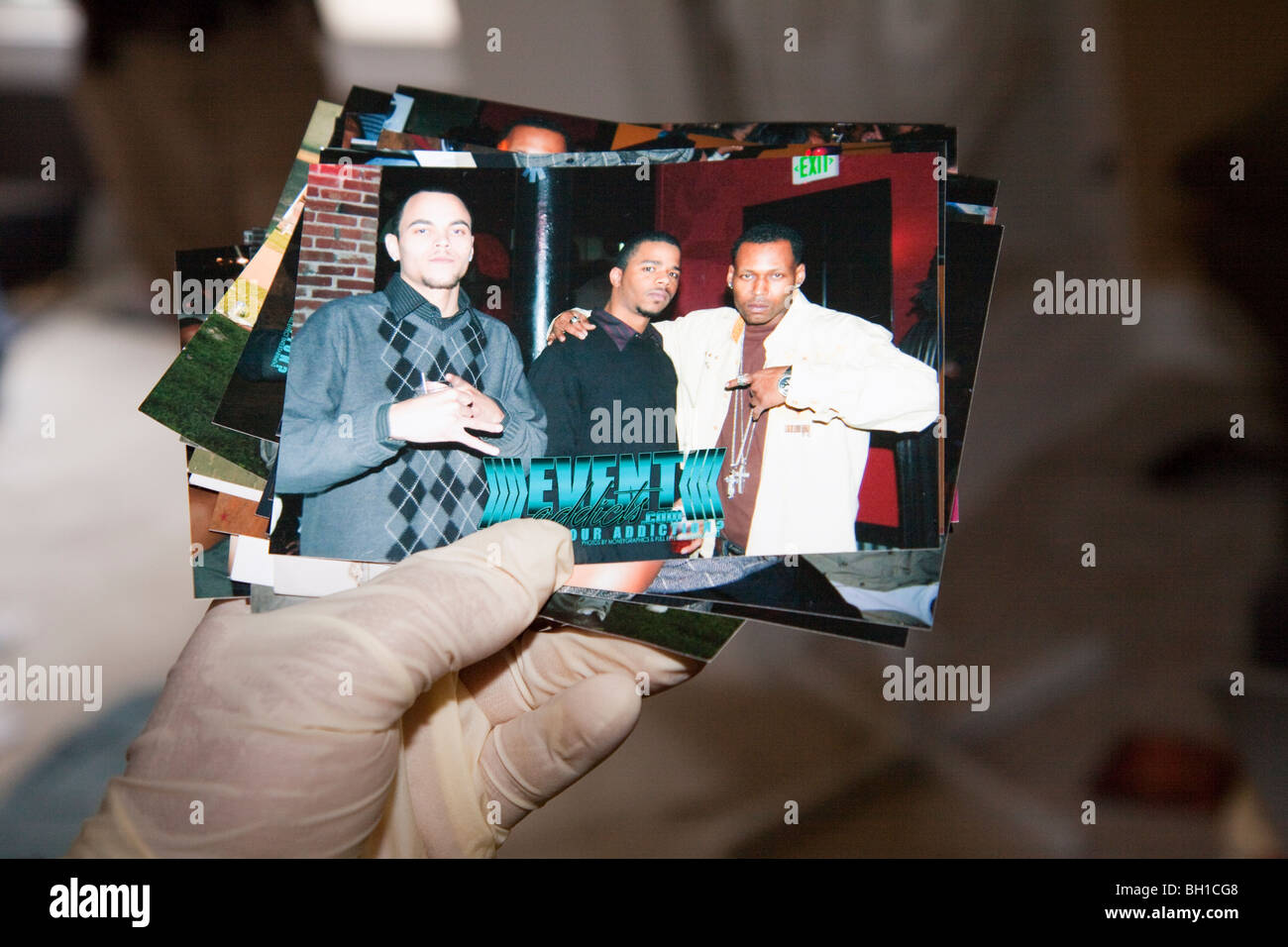 Photos located during the execution of a search warrant. Gang signs. Stock Photo