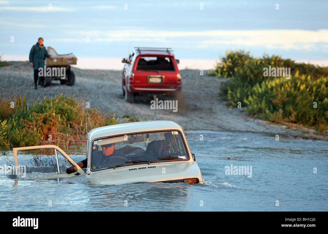 4WD stuck in high tide lagoon. Stock Photo