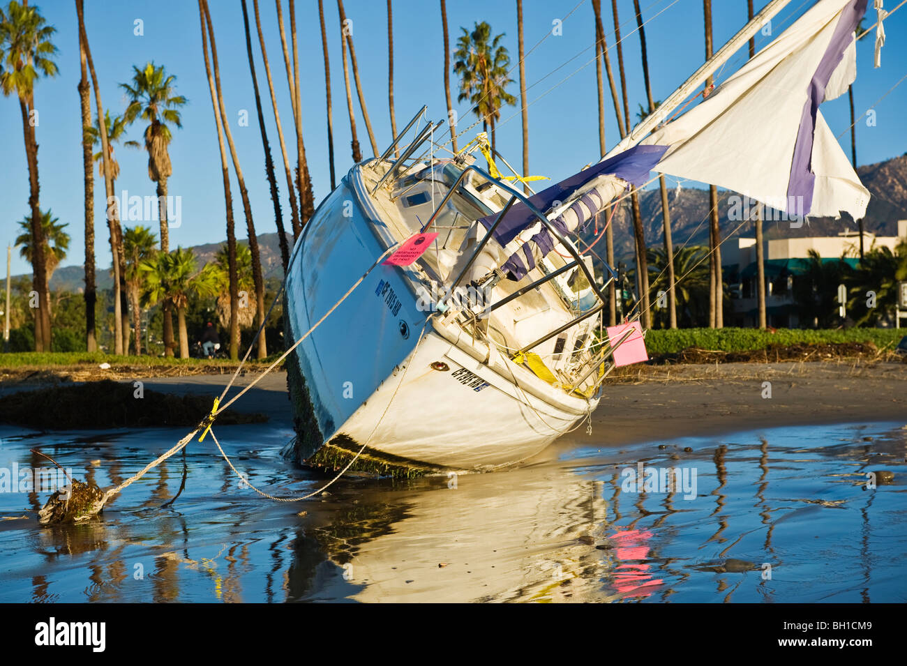 Santa Barbara, California: Sailboat washed ashore on beach during ...