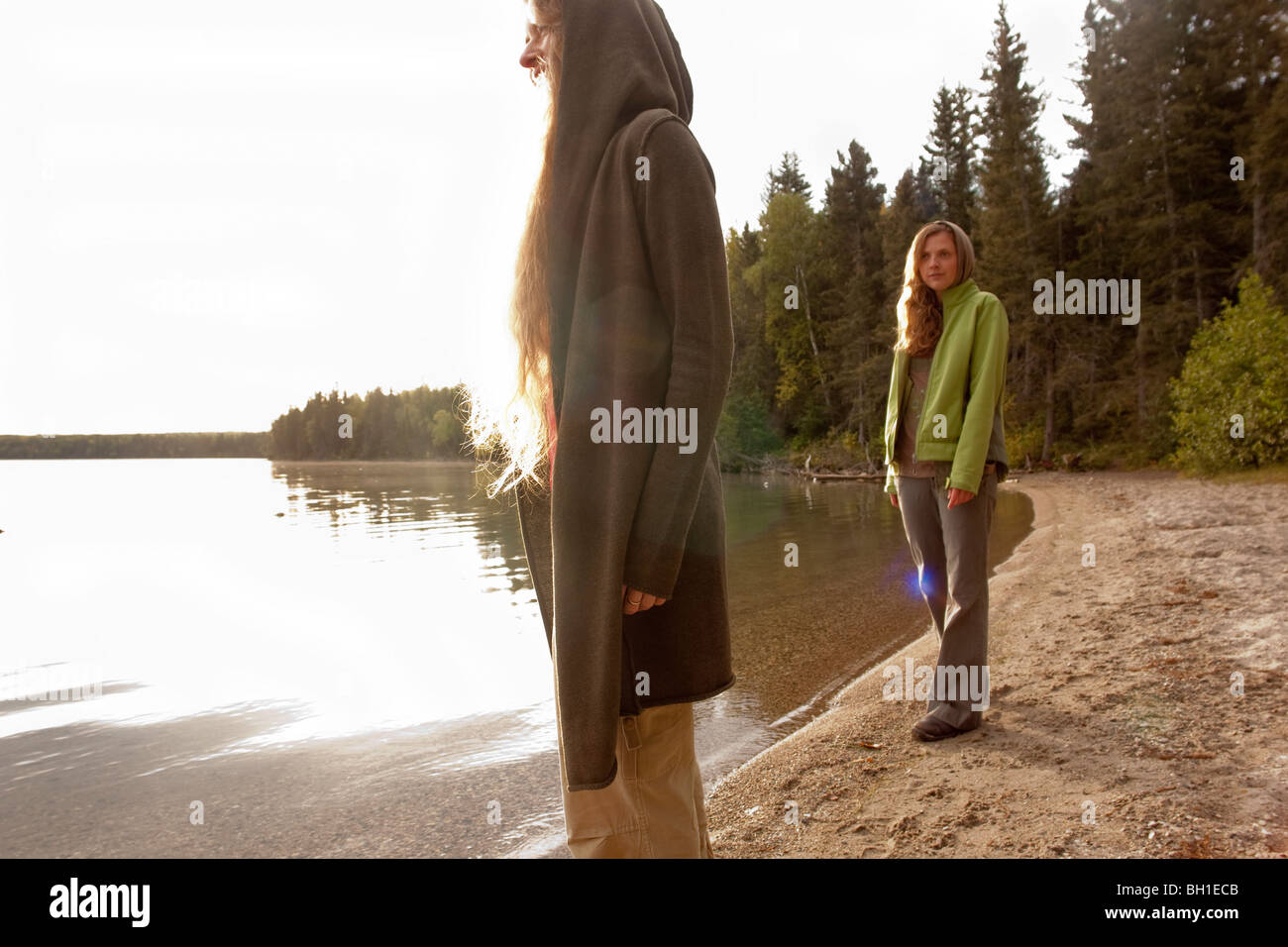 Two women on shoreline of Clear Lake, Riding Mountain National Park, Manitoba, Canada Stock Photo