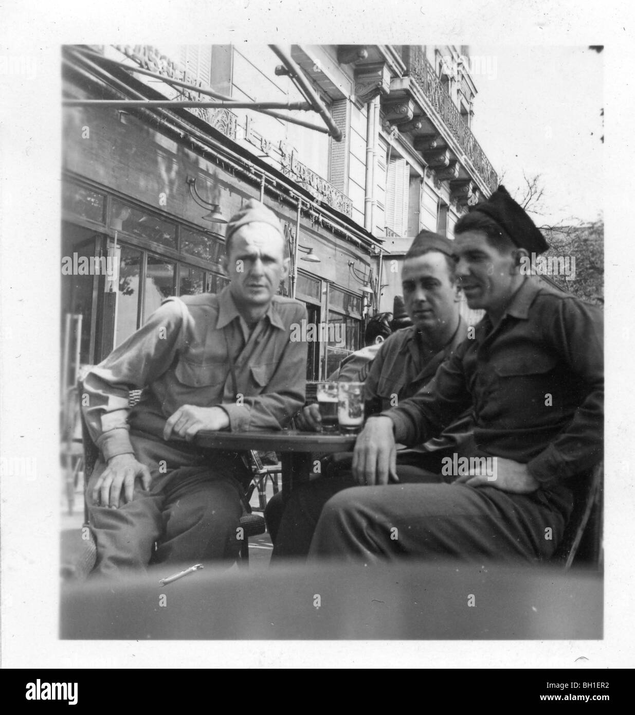 American GIs at sidewalk cafe in liberated Paris, France at the conclusion of WWII. Stock Photo