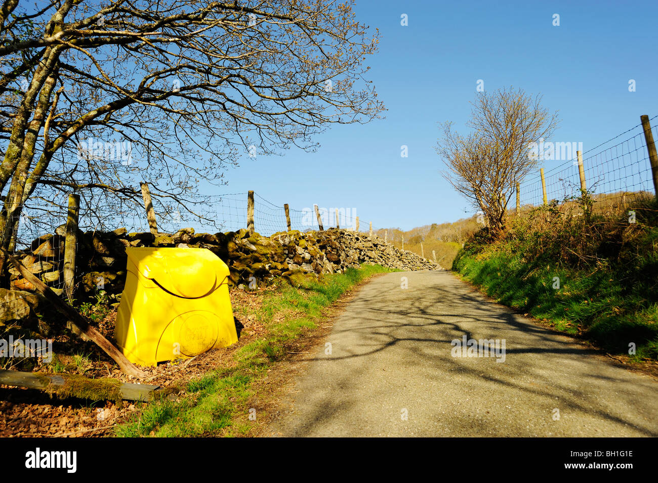 Yellow grit bin on single track road in Snowdonia Stock Photo Alamy