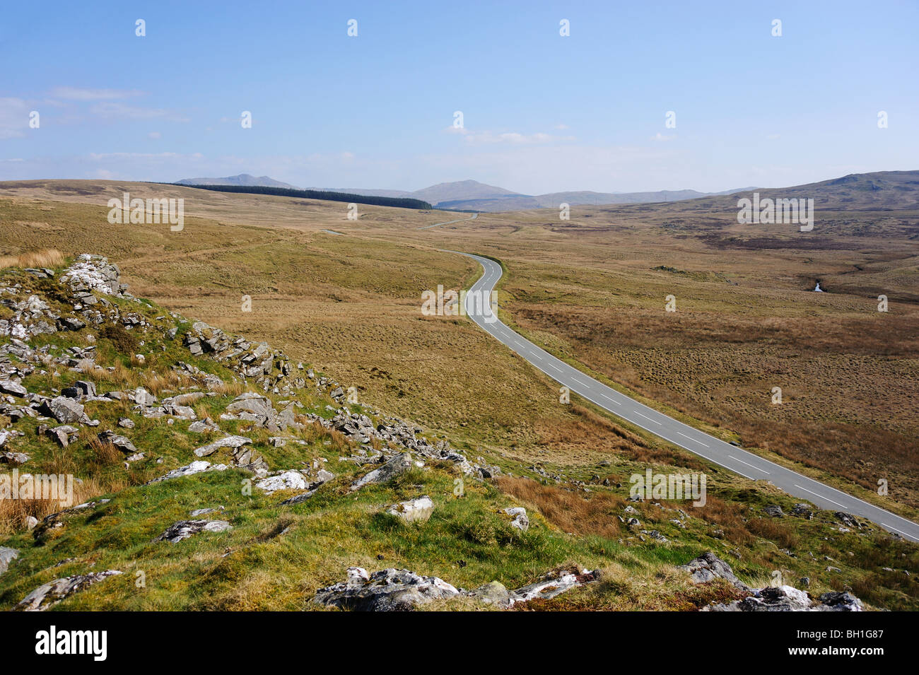 Road crossing the upland blanket bog and heathland vegetation of Migneint in Gwynedd, North Wales. Stock Photo