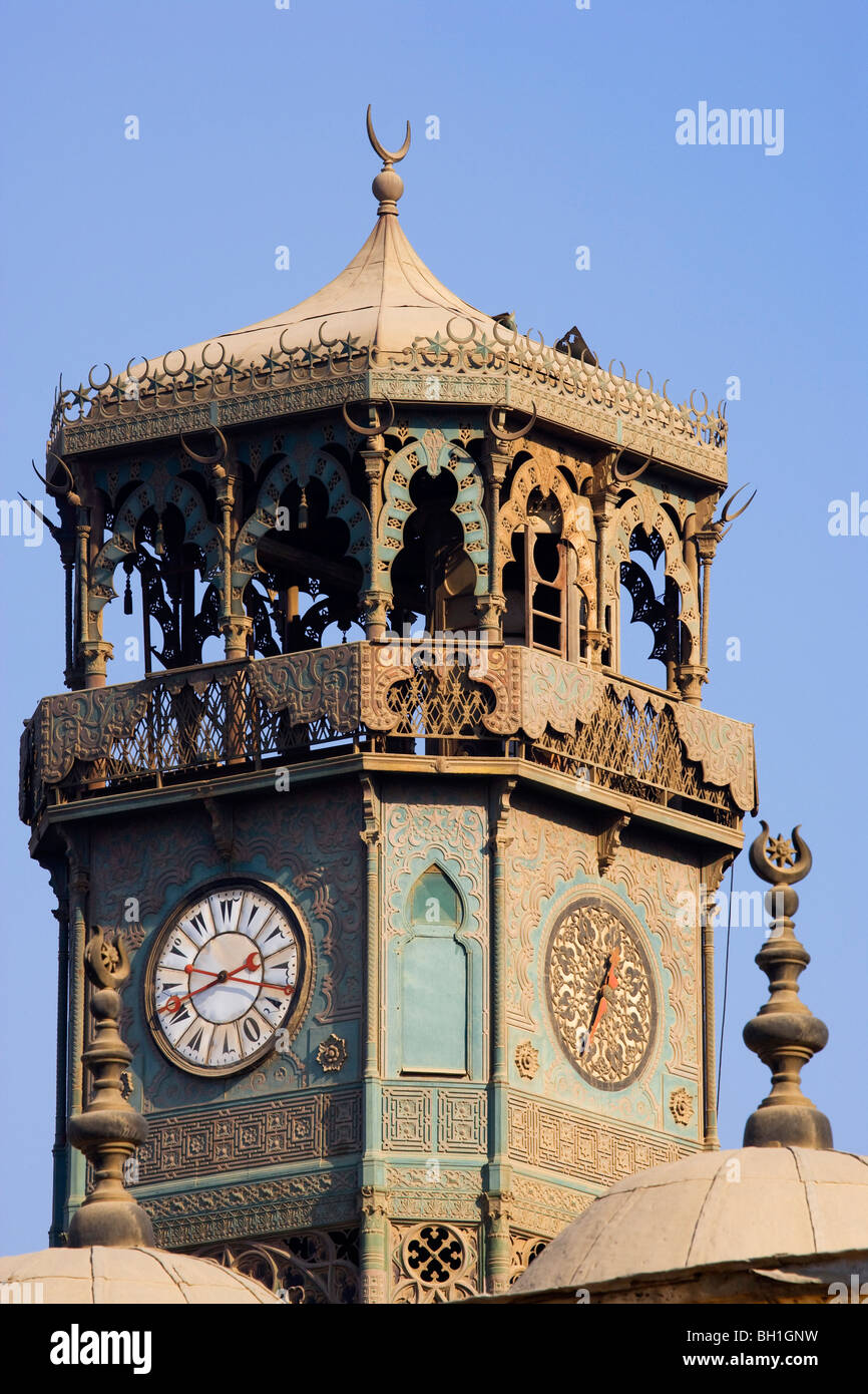 Clock tower of the mosque of Muhammad Ali in front of blue sky, Cairo