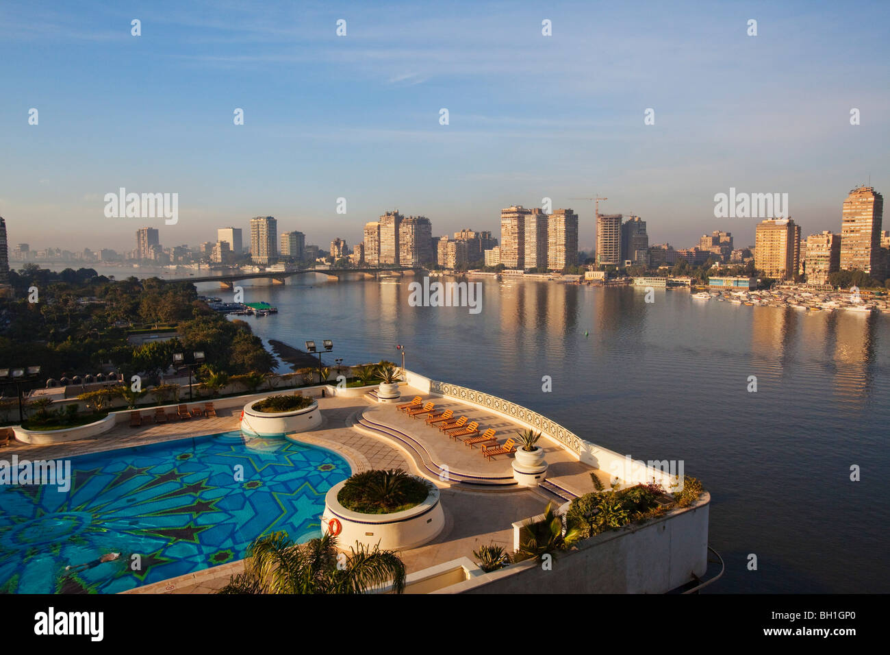View at the pool of the Grand Hyatt hotel and high rise buildings on the banks of the river Nile, Cairo, Egypt, Africa Stock Photo