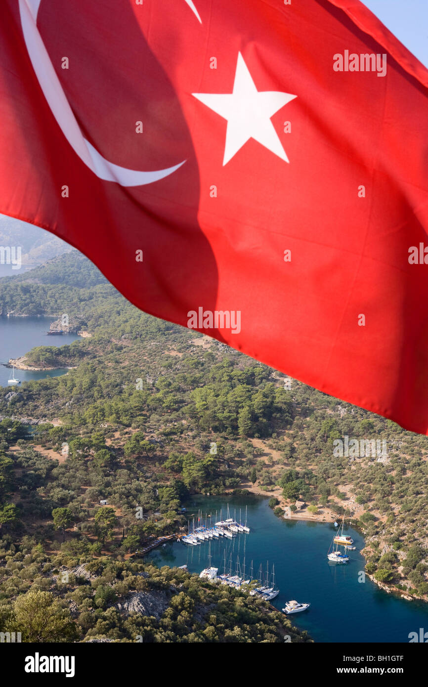 The flag of Turkey in front of the small bay Kapi Creek, Fethiye Bay, Turkey, Europe Stock Photo