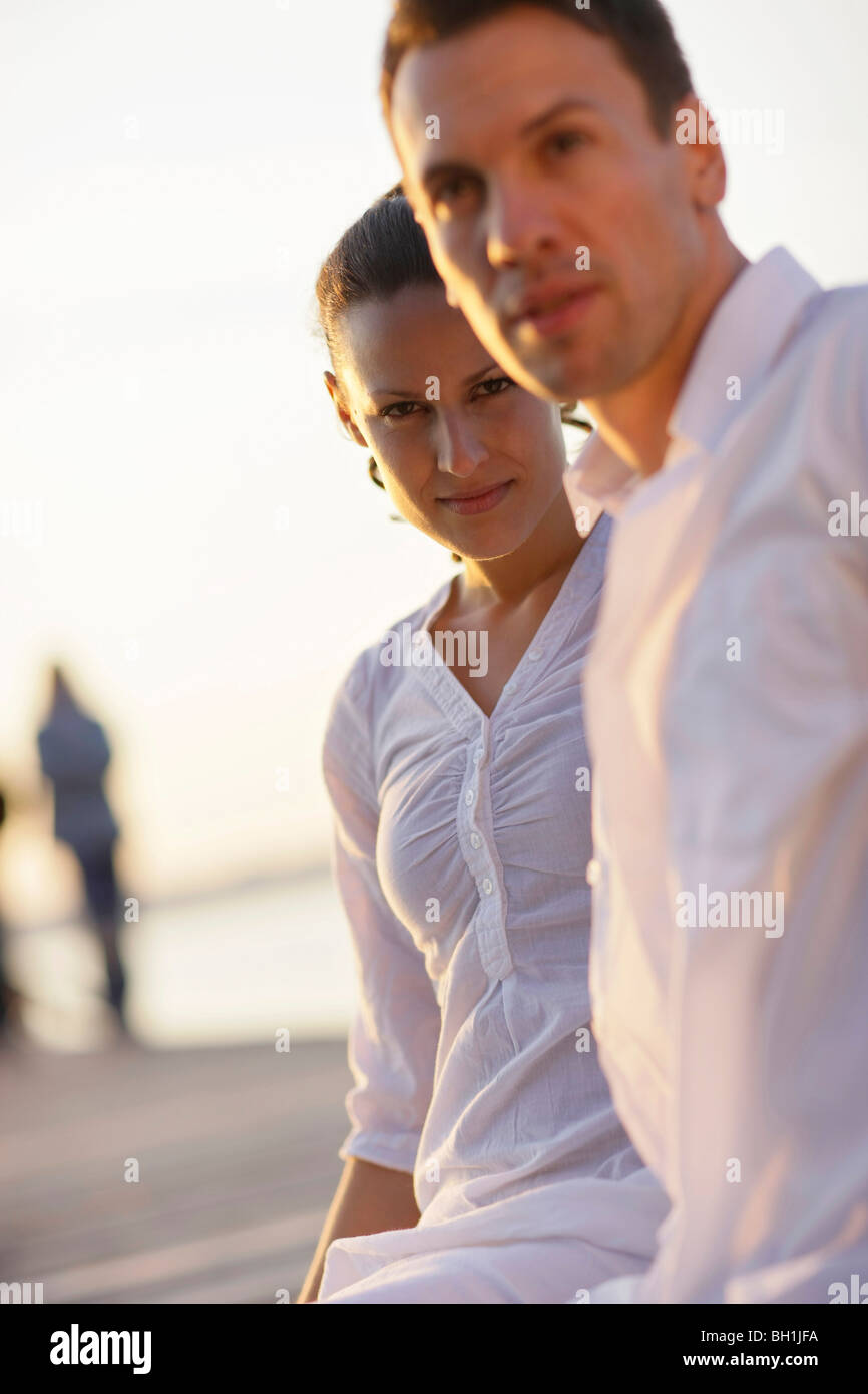 Mid adult couple in sunset, Ambach, Lake Starnberg, Bavaria, Germany Stock Photo