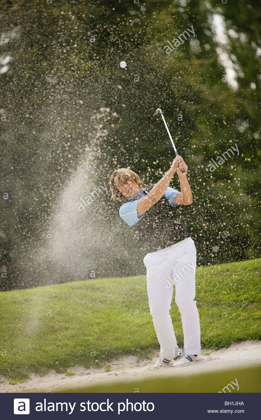 hitting a golf ball